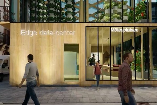 En animerad bild på mänsikor framför ett data center.